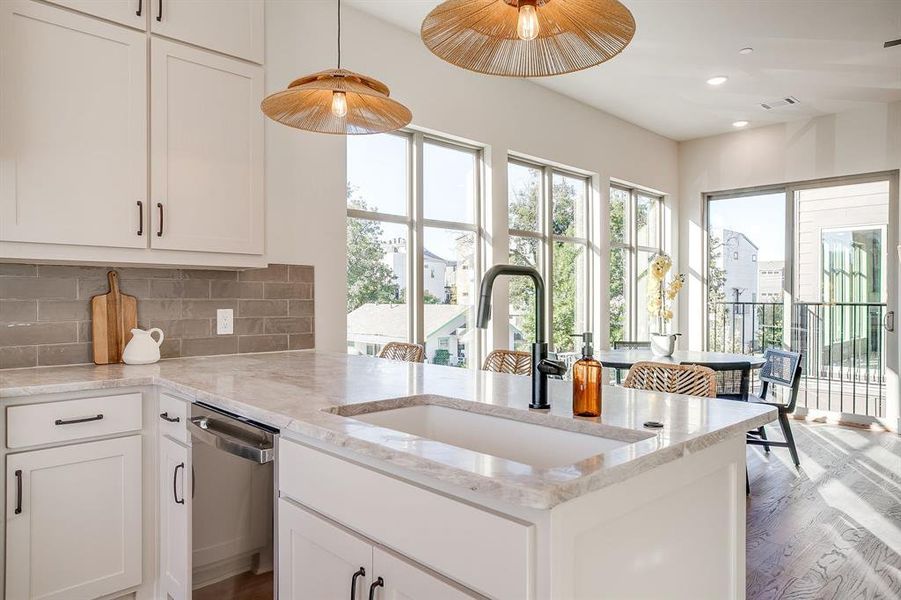 Custom cabinetry offers ample storage and seamless integration with the open-concept layout. Custom cabinetry offers ample storage and seamless integration with the open-concept layout.