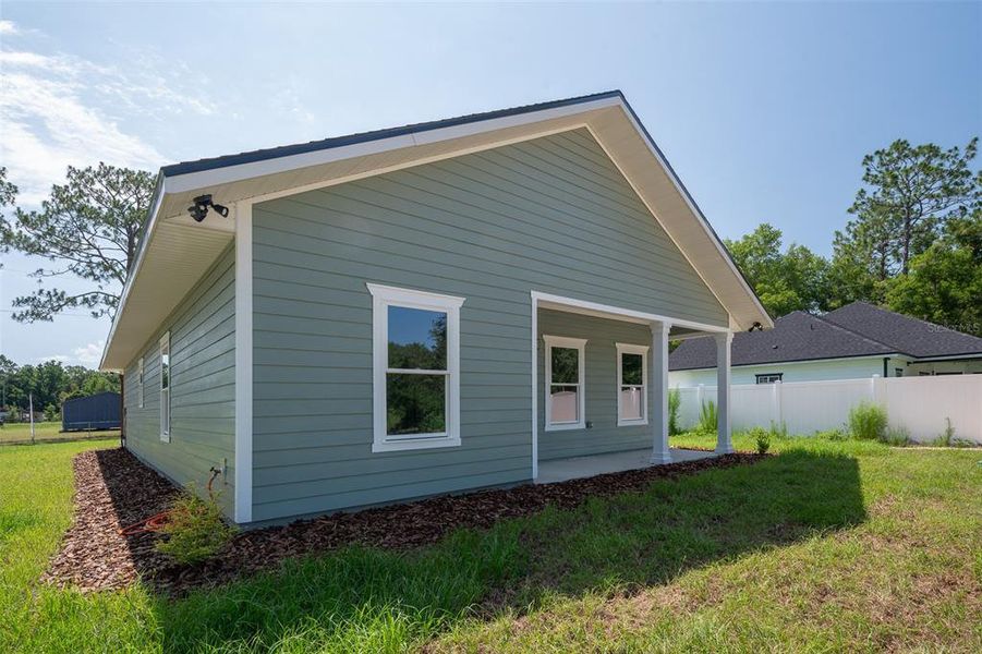 Exterior details and patio area of a home in , Williston (Image 3).