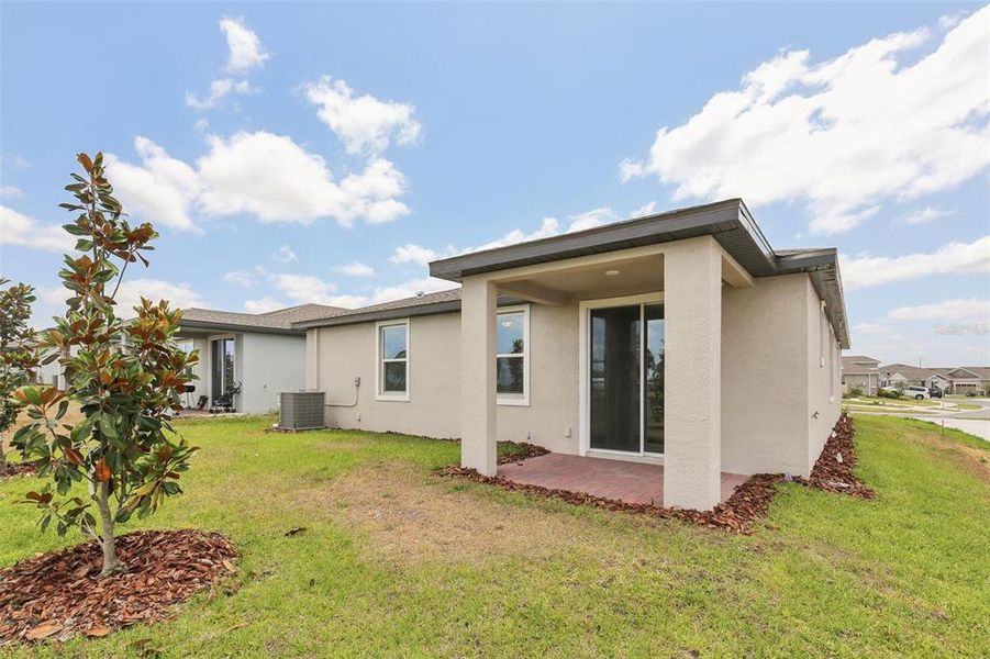Front exterior of a new home in Eden Hills, Lake Alfred, FL, highlighting curb appeal (Image 2).