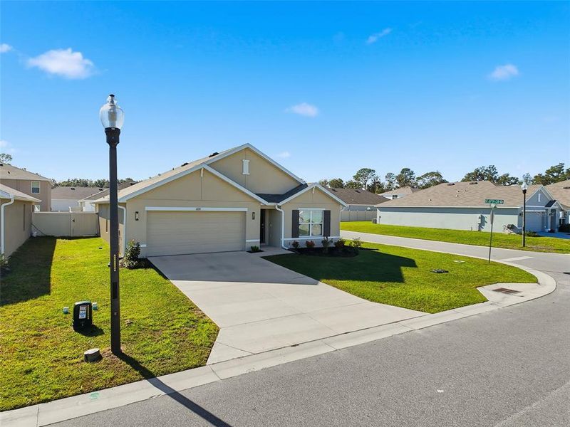 Front exterior of a new home in , Belleview, FL, highlighting curb appeal (Image 26). Front exterior of a new home in , Belleview, FL, highlighting curb appeal (Image 26).