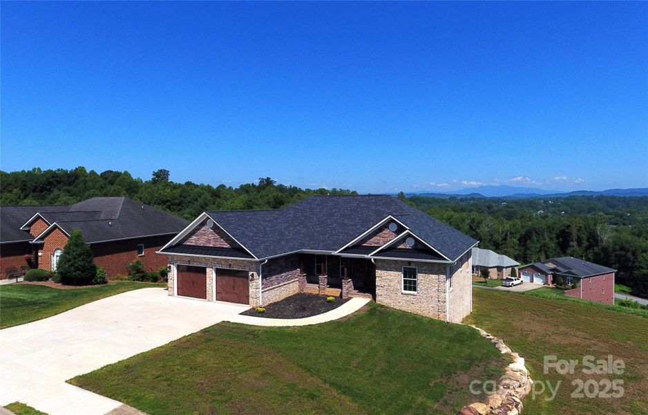 Front exterior of a new home in , Lenoir, NC, highlighting curb appeal (Image 24).
