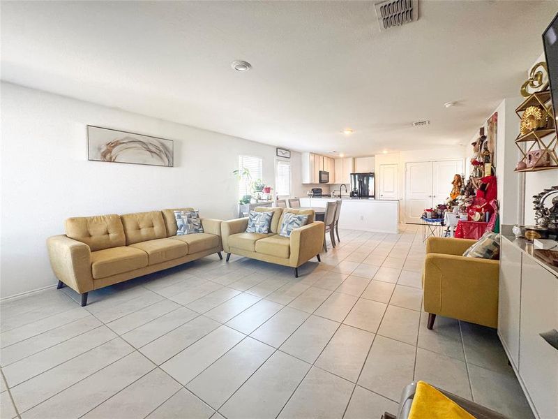 Living room featuring light tile patterned flooring