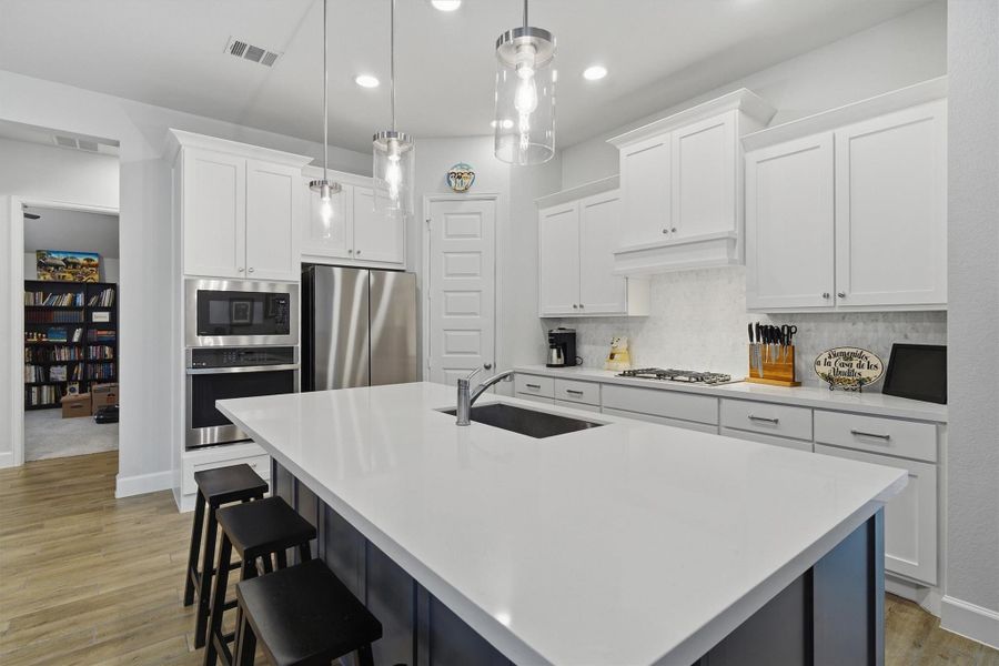 Beautiful kitchen! Stainless steel appliances, updated cabinets and modern light fixtures Beautiful kitchen! Stainless steel appliances, updated cabinets and modern light fixtures