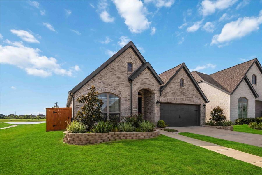 Front exterior of a new home in , Manvel, TX, highlighting curb appeal (Image 22). Front exterior of a new home in , Manvel, TX, highlighting curb appeal (Image 22).