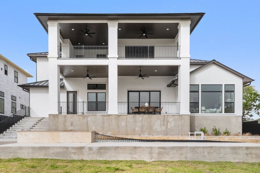 Front exterior of a new home in Milky Way at River Place, Austin, TX, highlighting curb appeal (Image 4).