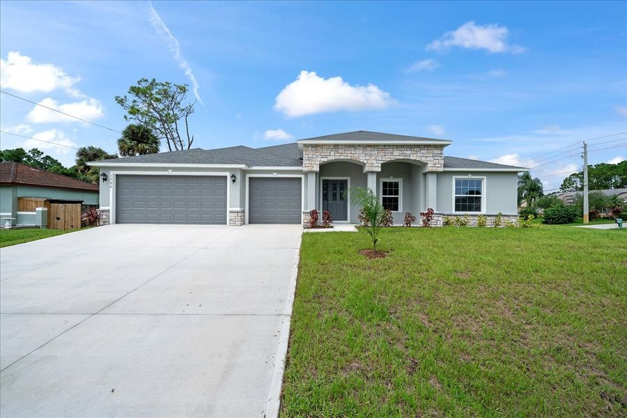Representative exterior photo of a completed home built from the The Newport by Avtec Homes in Palm Bay & South Brevard, Palm Bay, FL (Image 27).