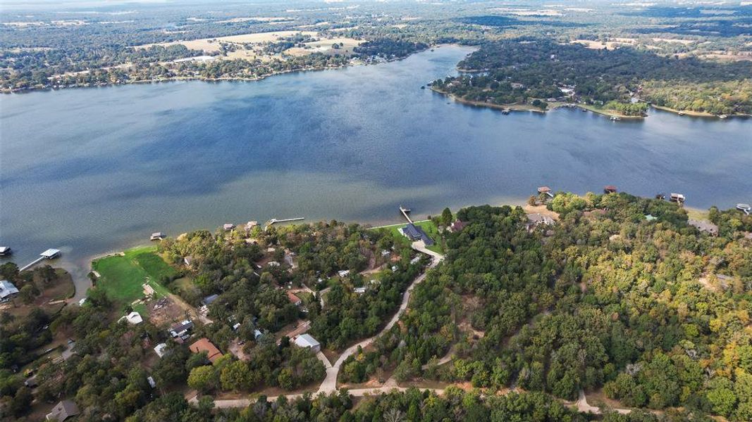Aerial view of property's location featuring a large body of water Aerial view of property's location featuring a large body of water