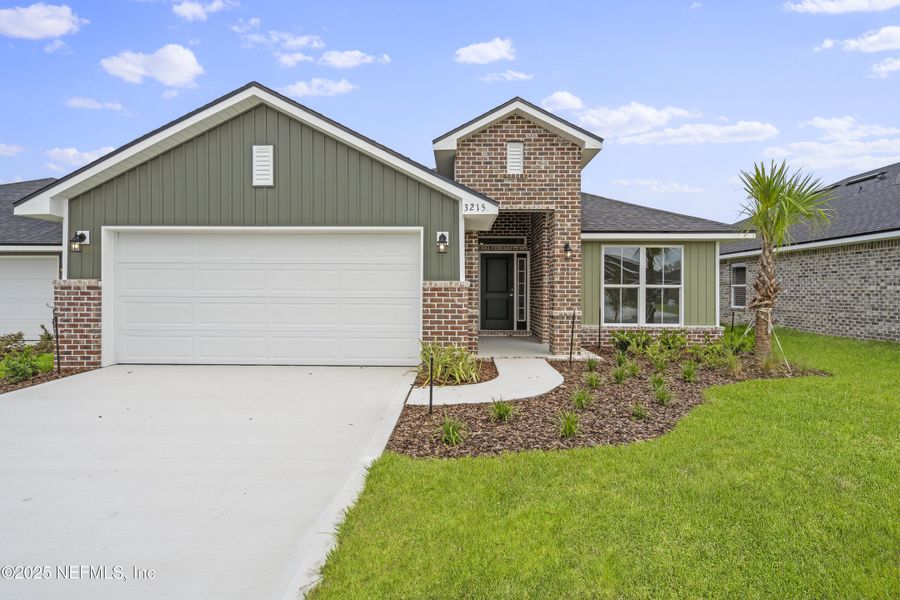 Front exterior of a new home in , Green Cove Springs, FL, highlighting curb appeal (Image 1). Front exterior of a new home in , Green Cove Springs, FL, highlighting curb appeal (Image 1).