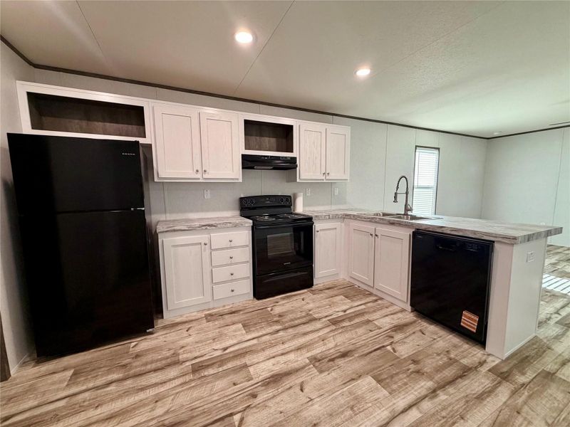 Furnished interior view inside a new home in , Oyster Creek (Image 4).