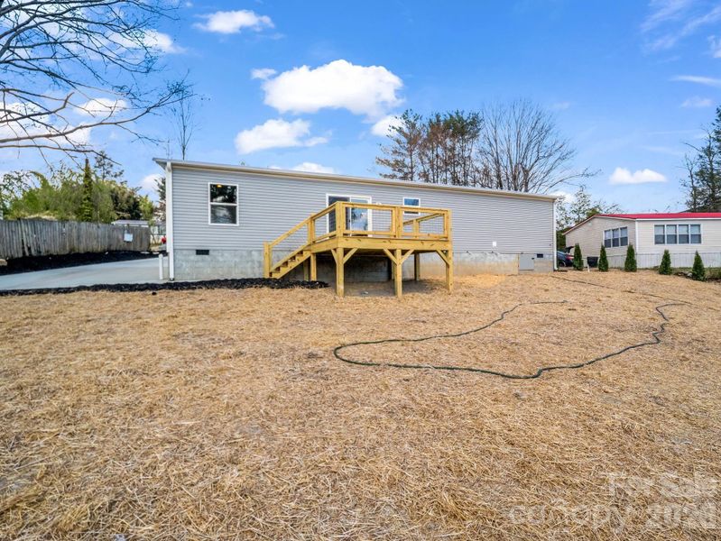 Exterior details and patio area of a home in , East Flat Rock (Image 22).