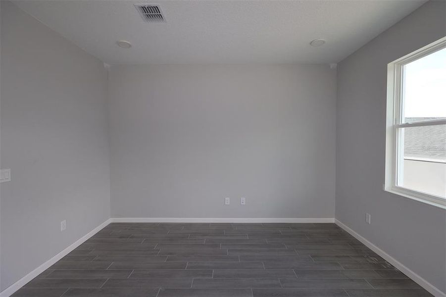 Spacious, unfurnished interior of a new home in Tribute at Ovation, Winter Garden (Image 17).