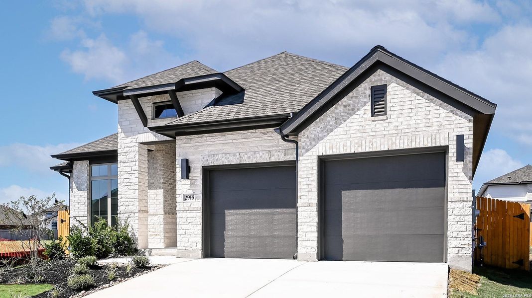 Front exterior of a new home in Meadows of Mill Creek, Seguin, TX, highlighting curb appeal (Image 21).