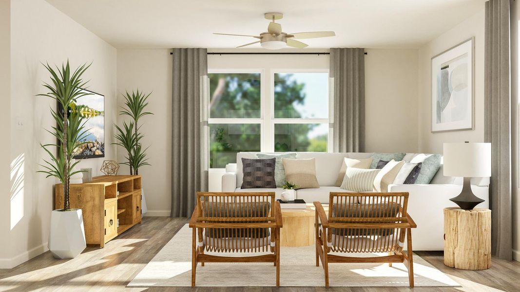 A living room with a white couch and a table.