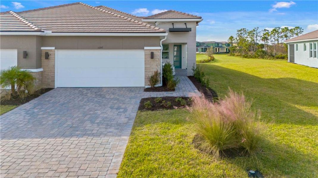 Front exterior of a new home in , Venice, FL, highlighting curb appeal (Image 27). Front exterior of a new home in , Venice, FL, highlighting curb appeal (Image 27).