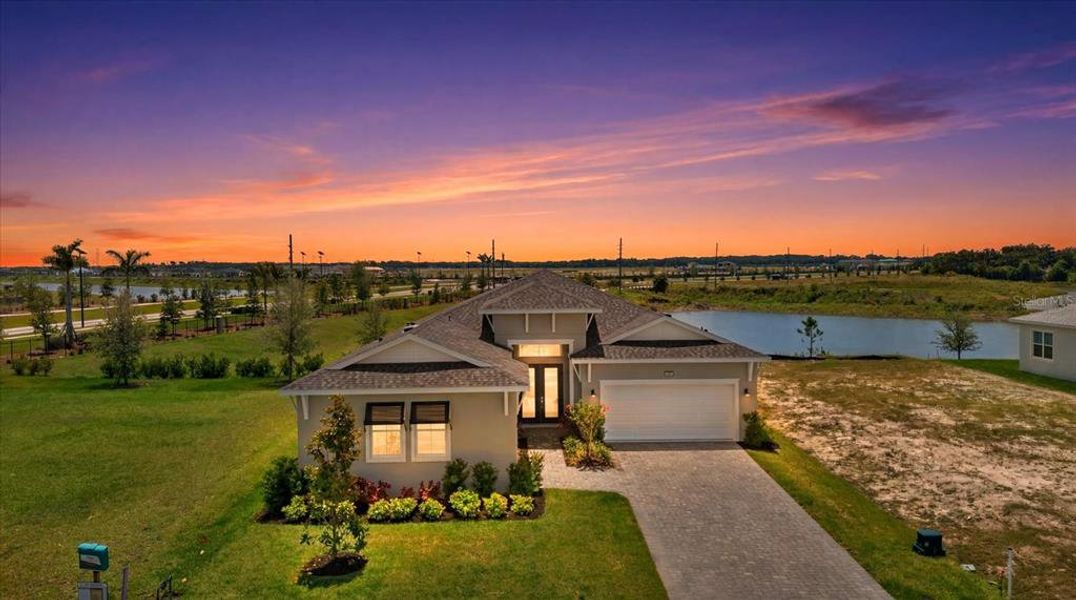 Front exterior of a new home in , Parrish, FL, highlighting curb appeal (Image 21).