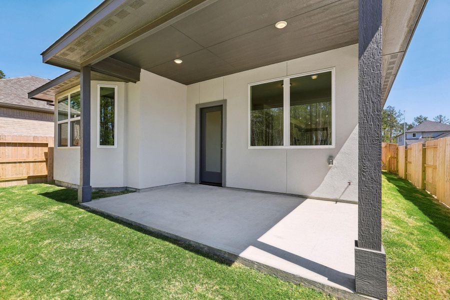 Exterior details and patio area of a home in Woodhavyn 40', Magnolia (Image 22).