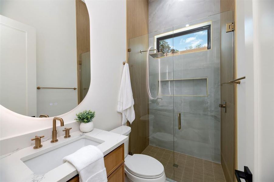 Full bath featuring vanity and a stall shower Full bath featuring vanity and a stall shower