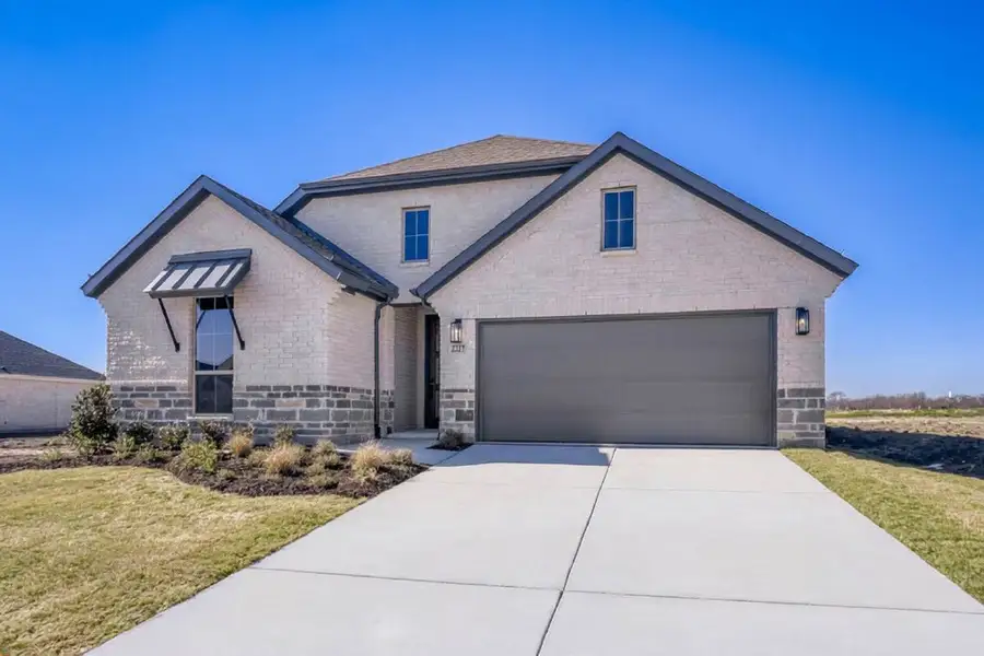 Front exterior of a new home in Meraki, Forney, TX, highlighting curb appeal (Image 20).