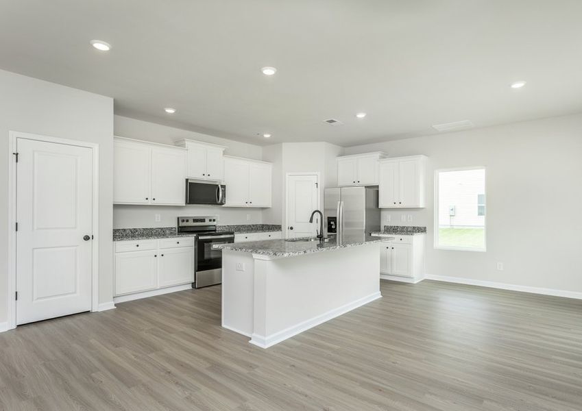 Vinyl plank flooring through the kitchen