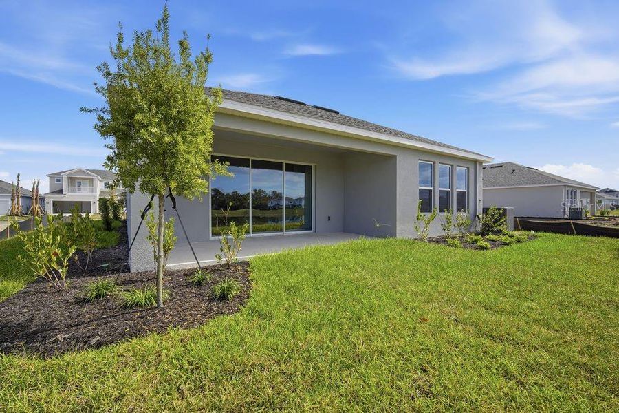 Exterior details and patio area of a home in Indigo Creek, Apollo Beach (Image 26).