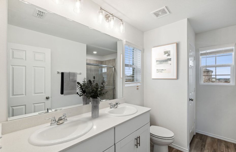 Owner's bath with double vanity and spacious shower