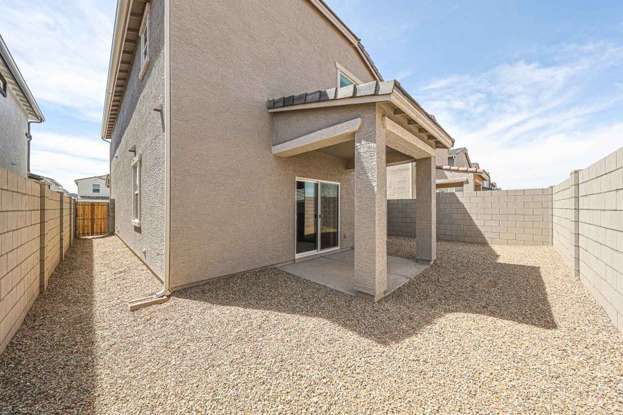 A building with a stone patio.