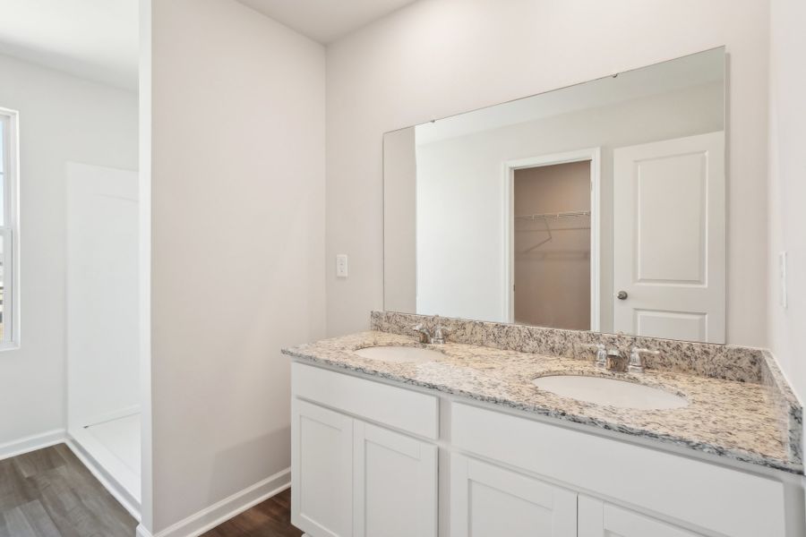 A bathroom with a marble countertop. A bathroom with a marble countertop.