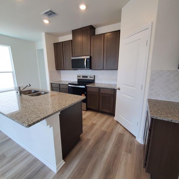 Furnished interior view inside a new home in Sonterra - Cool Water, Jarrell (Image 13).