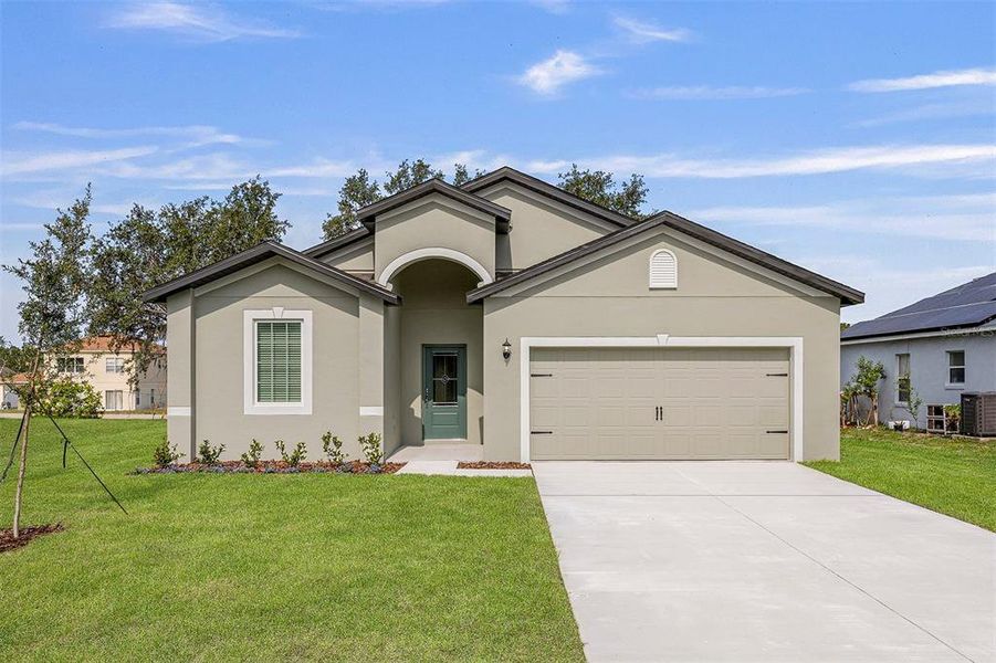 Front exterior of a new home in Poinciana, Poinciana, FL, highlighting curb appeal (Image 1). Front exterior of a new home in Poinciana, Poinciana, FL, highlighting curb appeal (Image 1).