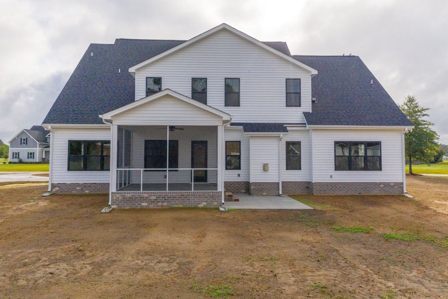Representative exterior photo of a completed home built from the Carson by Bill Clark Homes in Cheshire Landing, Grimesland, NC (Image 32). Representative exterior photo of a completed home built from the Carson by Bill Clark Homes in Cheshire Landing, Grimesland, NC (Image 32).