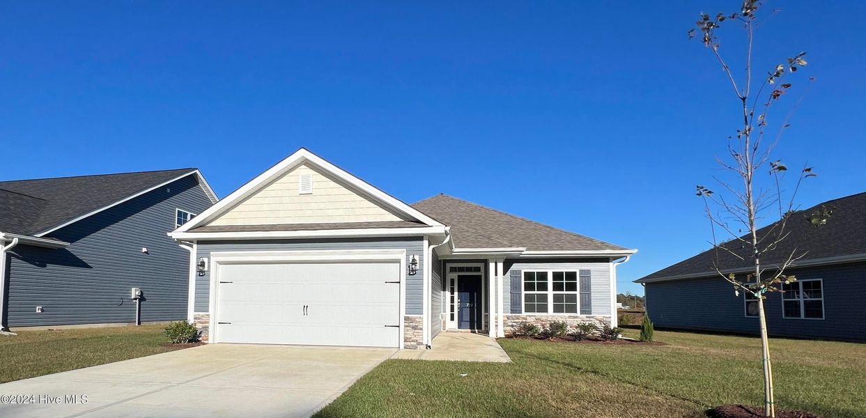 Front exterior of a new home in Waverly Place, Richlands, NC, highlighting curb appeal (Image 1).
