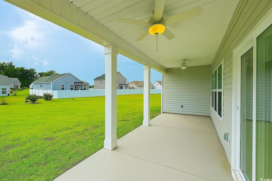 View of patio with ceiling fan and a residential view View of patio with ceiling fan and a residential view