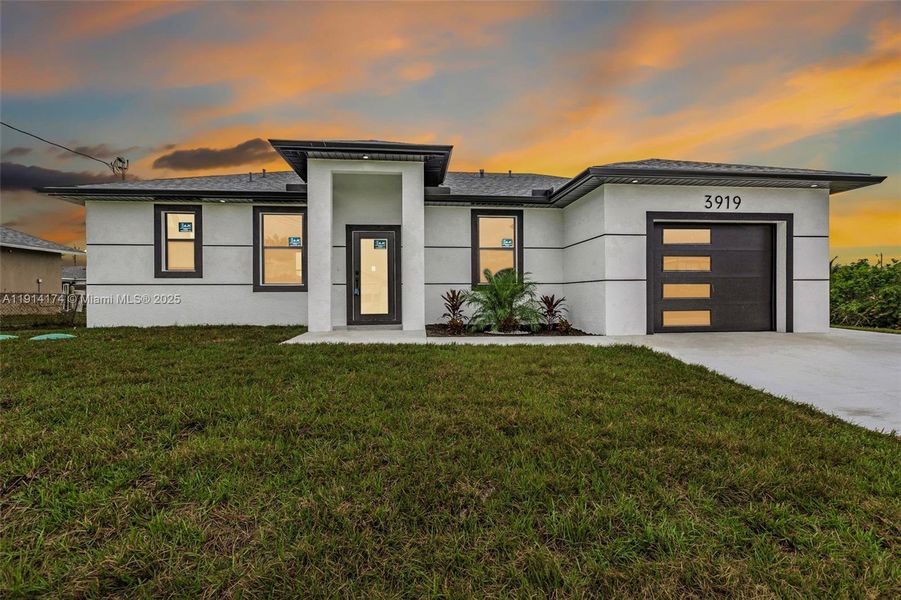 Front exterior of a new home in , Lehigh Acres, FL, highlighting curb appeal (Image 28).