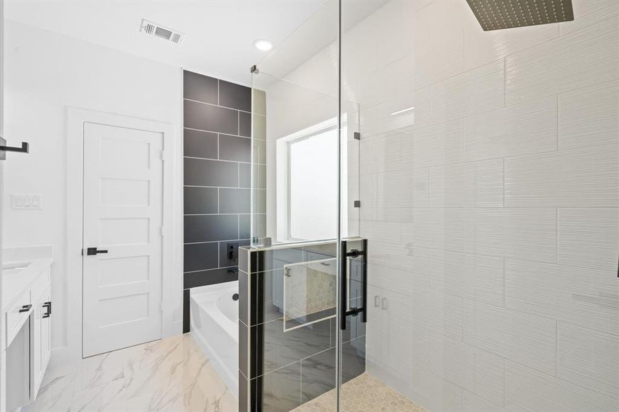 Walk-in shower & soaking tub in master bathroom