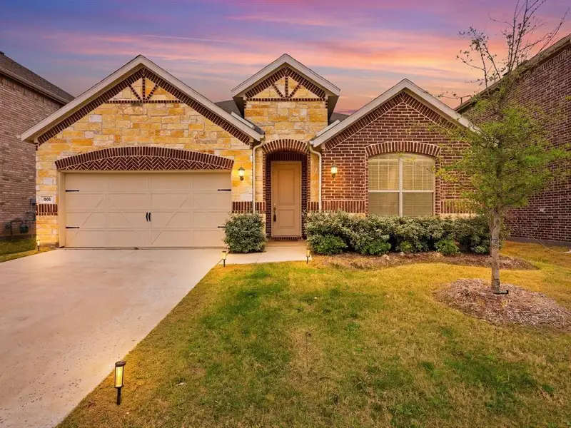 Front exterior of a new home in , Little Elm, TX, highlighting curb appeal (Image 1). Front exterior of a new home in , Little Elm, TX, highlighting curb appeal (Image 1).