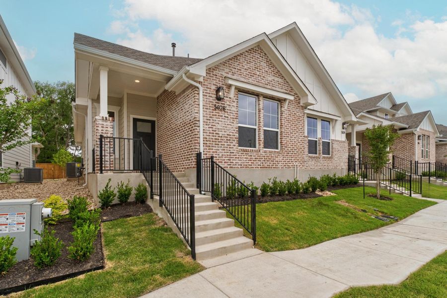 Front exterior of a new home in , Buda, TX, highlighting curb appeal (Image 1).