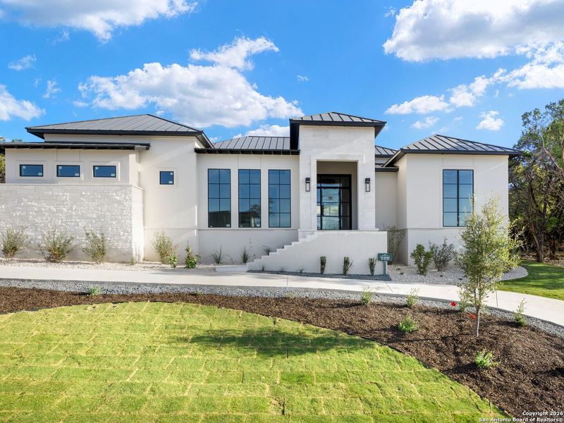 Front exterior of a new home in , San Antonio, TX, highlighting curb appeal (Image 14).
