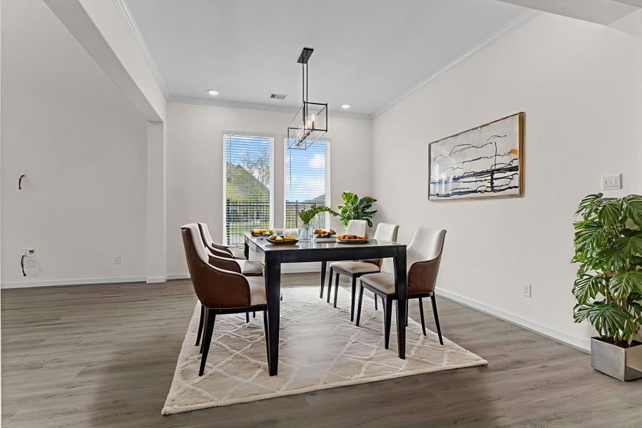 Photo is Virtually Staged — Elegant dining room with upgraded lighting, large window views, and open flow into the living spaces — perfect for entertaining guests. Photo is Virtually Staged — Elegant dining room with upgraded lighting, large window views, and open flow into the living spaces — perfect for entertaining guests.