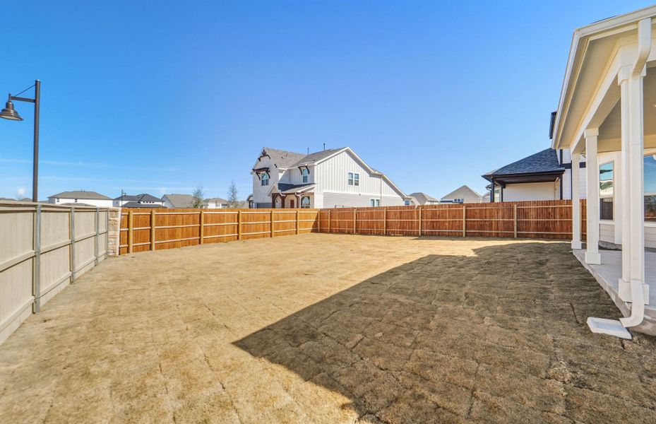 Exterior details and patio area of a home in Santa Rita Ranch, Liberty Hill (Image 30).
