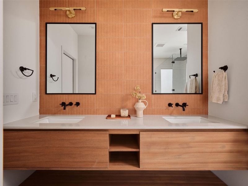 Full bath featuring double vanity, dark wood-type flooring, and a walk in shower
