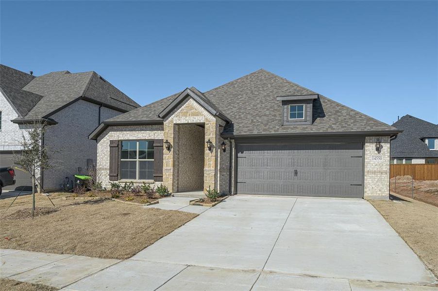 Front exterior of a new home in Creekview Meadows, Pilot Point, TX, highlighting curb appeal (Image 20).
