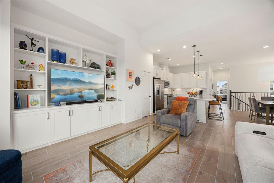 Better than new construction- custom built in shelving in the living room adds both character and storage.