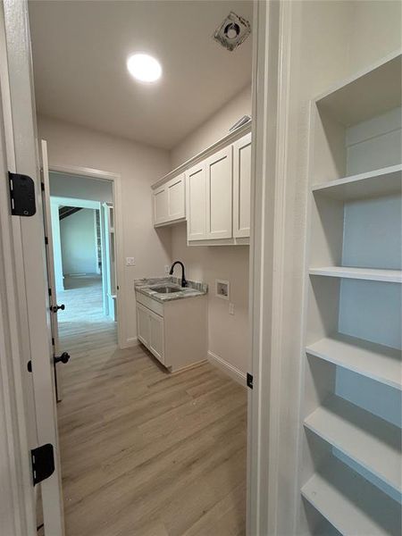 Primary closet conveniently connects to the utility room