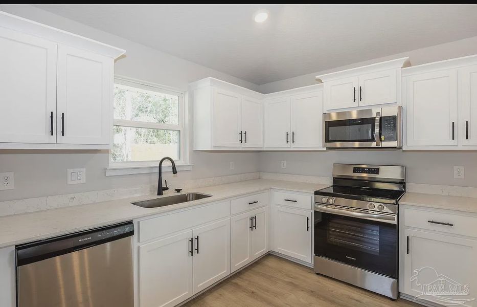 Furnished interior view inside a new home in Hidden Pines Estates, Milton (Image 7).