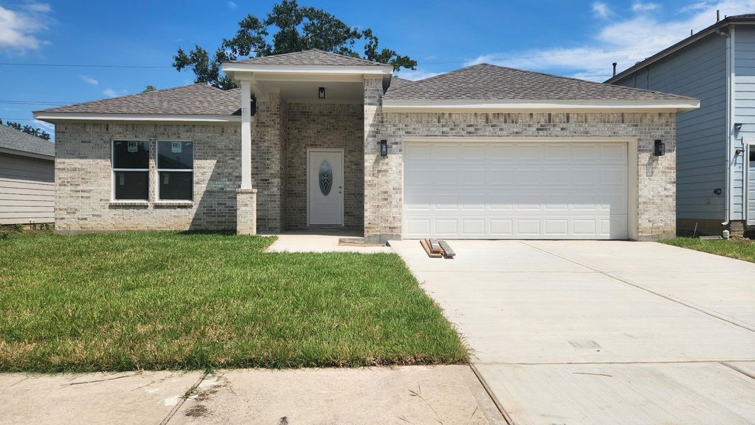 Front exterior of a new home in , Humble, TX, highlighting curb appeal (Image 13).