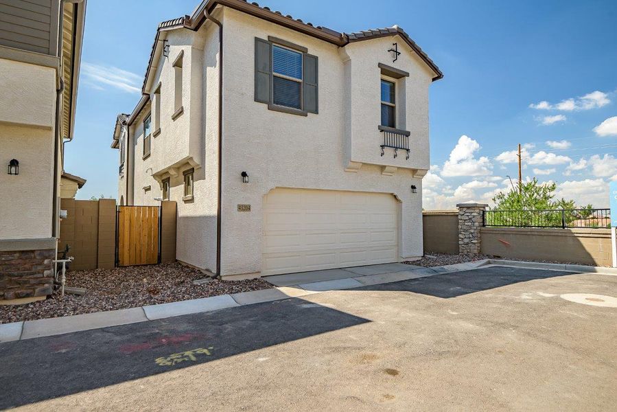 Front exterior of a new home in Ironwood Villages at North Creek, Queen Creek, AZ, highlighting curb appeal (Image 26).