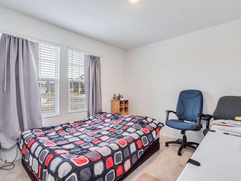The second bedroom, located at the front of the house, is ideal for an office