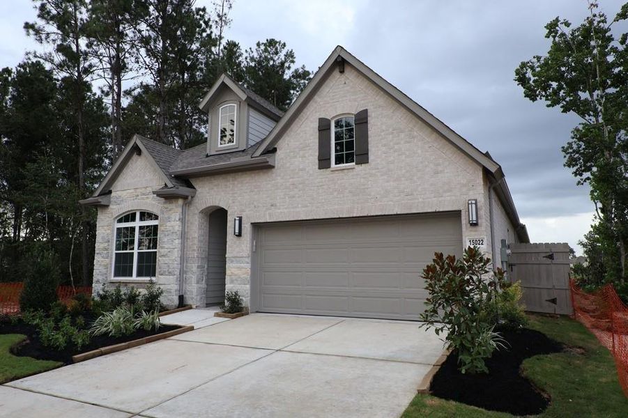 Front exterior of a new home in ARTAVIA 45' Homesites, Conroe, TX, highlighting curb appeal (Image 21).