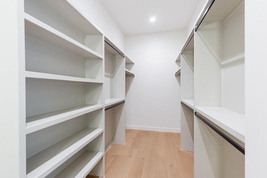 Walk in closet featuring light wood-type flooring