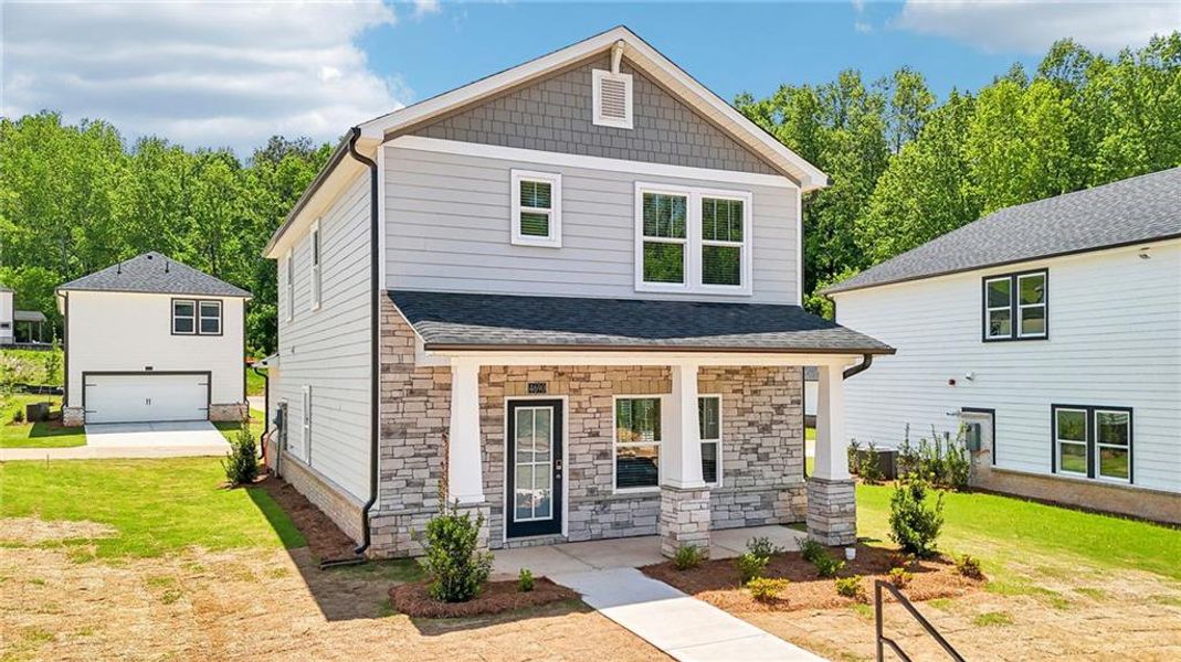 Front exterior of a new home in Hemingway - Cottage Series, Cumming, GA, highlighting curb appeal (Image 23). Front exterior of a new home in Hemingway - Cottage Series, Cumming, GA, highlighting curb appeal (Image 23).